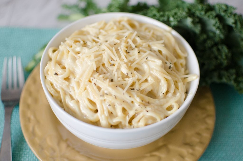 Instant Pot Dump and Start Alfredo made completely from scratch in under 20 minutes! This rich, creamy & dreamy meal is picky eater and kid friendly- making this meal a no-brainer!