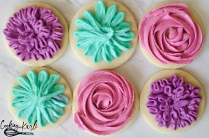 Sugar Cookie Frosting is a crusting vanilla buttercream that pipes and holds shape but tastes amazing at the same time! 