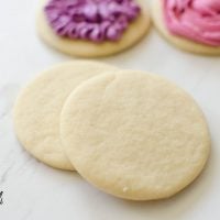 Perfect Sugar Cookie Recipe is really just that- PERFECT. These sugar cookies come together quickly with only 6 ingredients; butter, sugar, egg, vanilla, flour and baking soda. The cookies keep shape while baking, are soft and chewy, plus there is NO refrigeration! This Sugar Cookie recipe is PERFECTION!