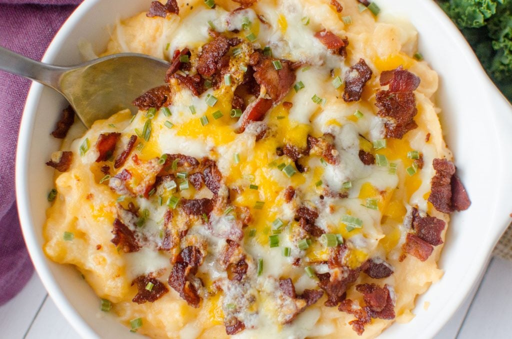 Barbecue Bacon Potato Casserole is a smokey twist on the classic twice baked potato. The creamy mashed potatoes are hit with a some barbecue sauce  to give the potatoes a whole new dimension. Bacon and cheese are broiled on the top until it reaches melty perfection.