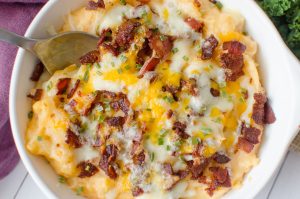 Barbecue Bacon Potato Casserole is a smokey twist on the classic twice baked potato. The creamy mashed potatoes are hit with a some barbecue sauce  to give the potatoes a whole new dimension. Bacon and cheese are broiled on the top until it reaches melty perfection