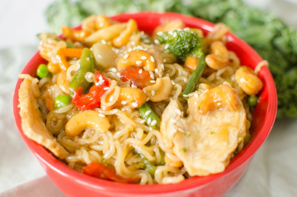 Instant Pot Cashew Chicken and Noodles is finished in no time, literally zero minutes on high pressure! The ramen noodles soak up the sweet sauce that perfectly pairs the veggies, cashews and chicken.