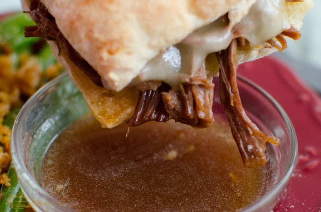 Instant Pot French Dip Sandwiches are sandwiches made from shredded beef with melted cheese served on toasted chibatta rolls and dunked in the flavorful Au Jus just before eating.