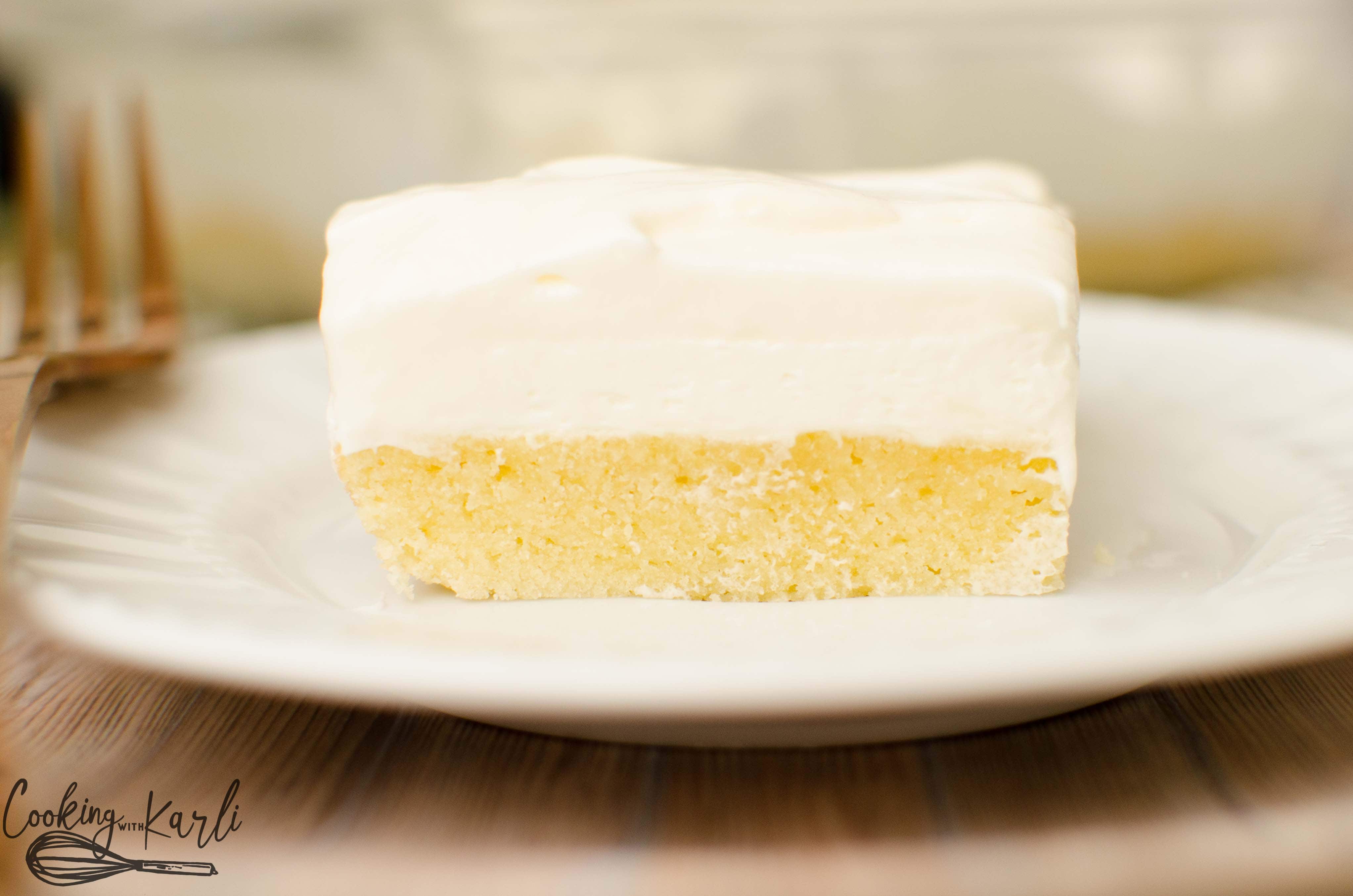 Vanilla Lush Cake is the combination of fluffy topping and a dense sugar cookie crust.