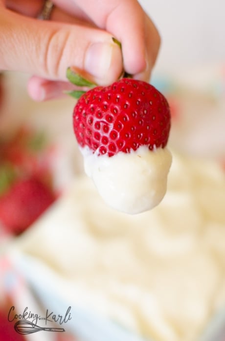 Strawberry Dipped into the cheesecake flavored fruit dip.