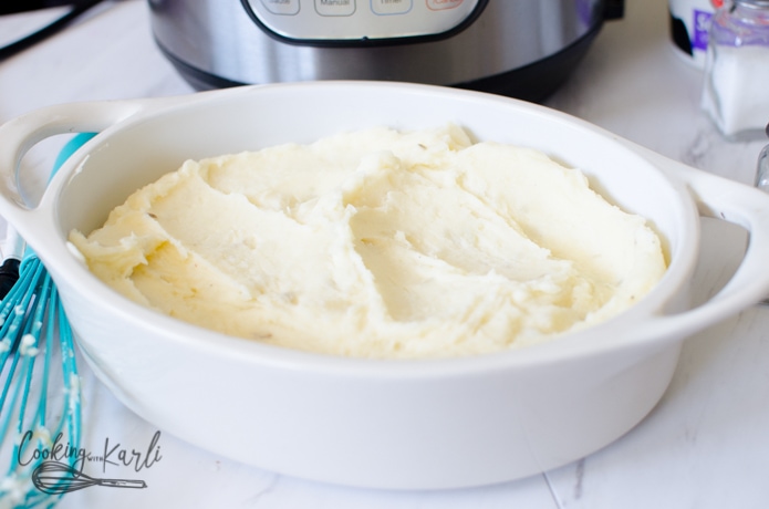 mashed potatoes made in the Instant Pot transferred to a baking dish for the next step.