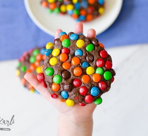 Chocolate cookie exploding with M&Ms.