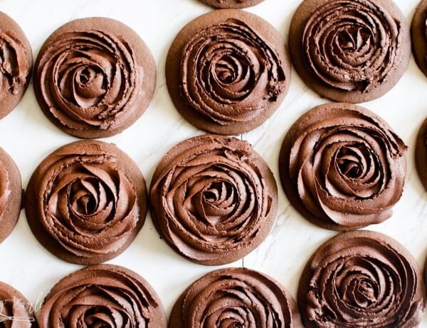 Chocolate roll and cut cookies decorated with chocolate buttercream