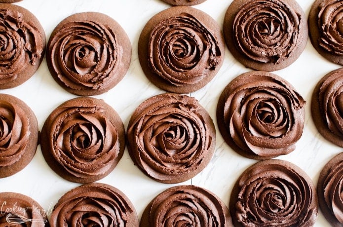 Chocolate roll and cut cookies decorated with chocolate buttercream