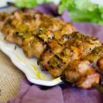 Bacon and chicken kabobs that are brushed with a homemade honey mustard sauce while being grilled.