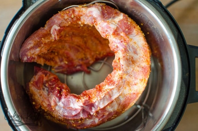 A rack of baby back ribs inside the Instant Pot.