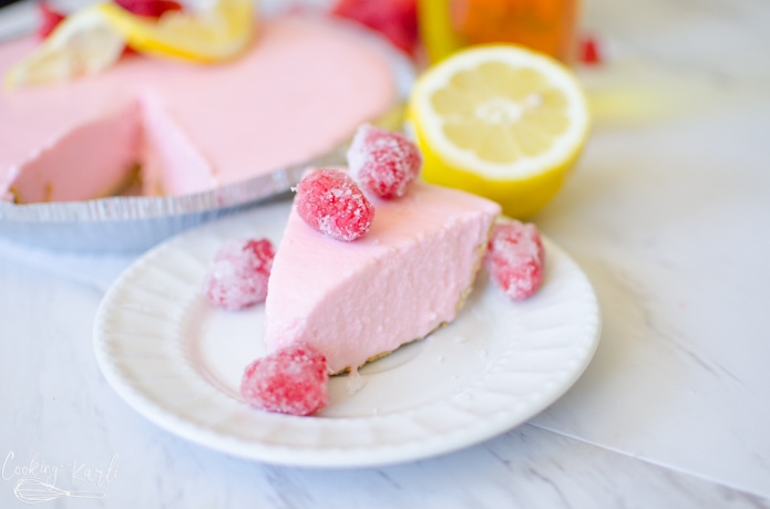 frosted raspberry lemonade pie, made with ice cream and raspberry lemonade concentrate inside of a graham cracker crust.