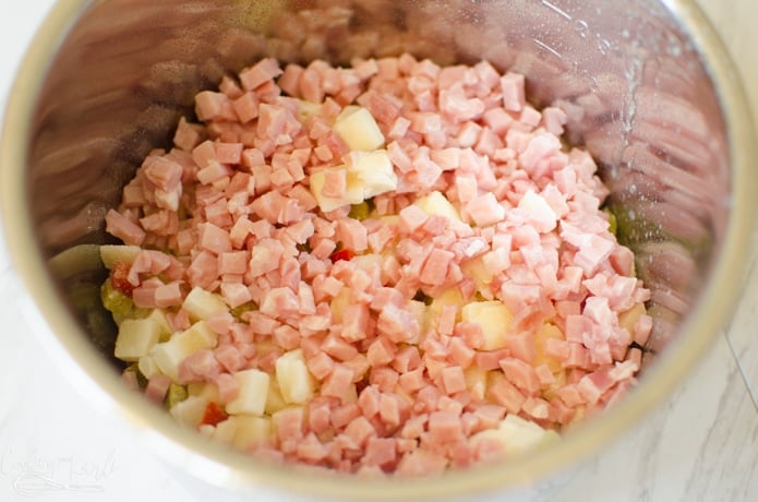 diced ham on top of the frozen hash browns in the small Instant Pot liner.