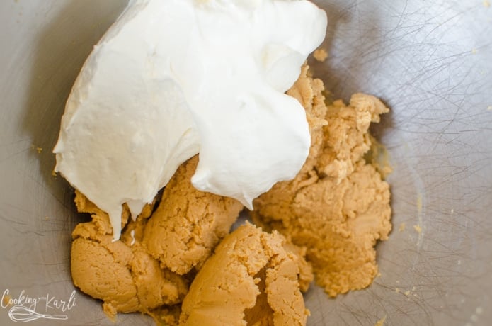 Cool whip and powdered sugar are added to the cream cheese and peanut butter.