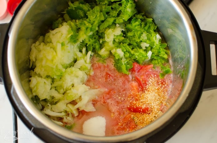 the onion, green bell pepper, jalapenos, tomatoes, minced garlic, vinegar, sugar, and salt in the instant pot before pressure cooking.