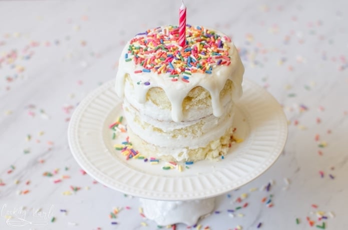Small, easy smash cake for a first birthday covered in sprinkles.