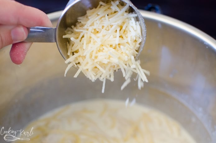 Shredded parmesan cheese is added to thicken the sauce.