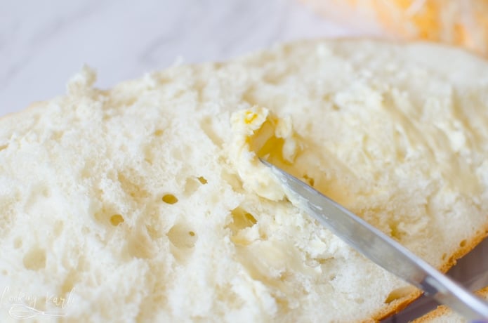 garlic and butter are combined and then spread onto the french bread halves.