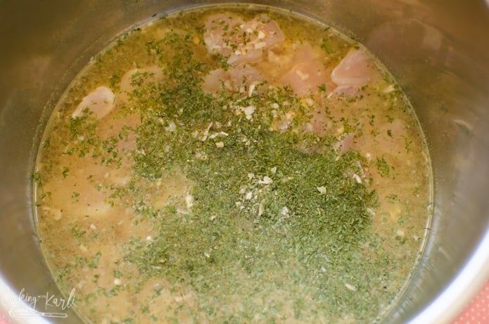 Broth, chicken chunks, parsley and onion in the Instant Pot 