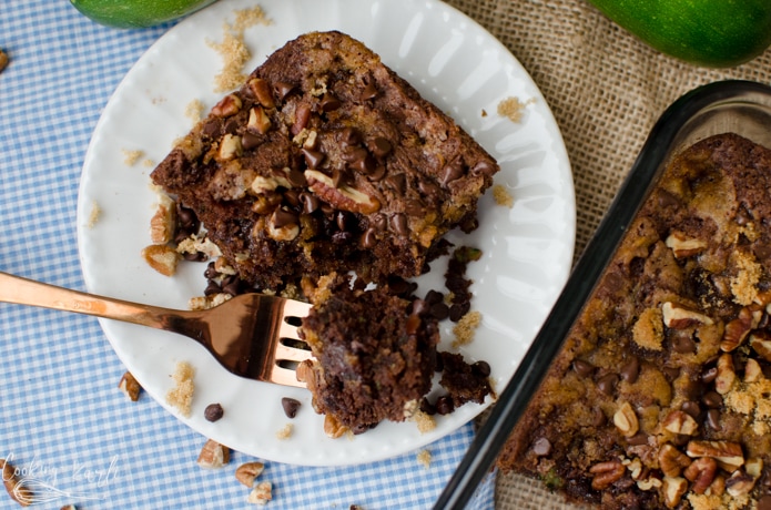 chocolate zucchini cake with a brown sugar, chopped nuts and chocolate chip topping.