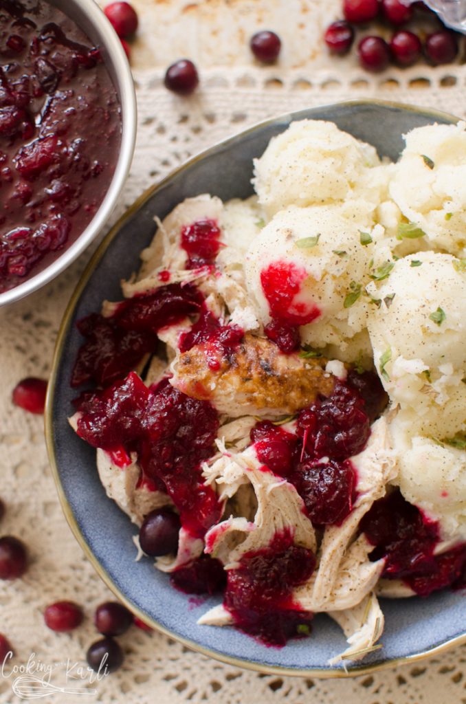 homemade cranberry sauce on turkey, plated.