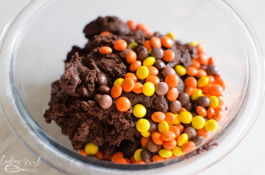 mini Reese's pieces added to the chocolate cookie batter