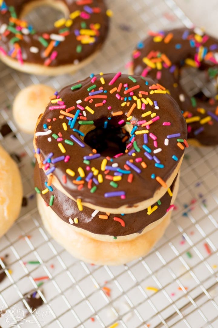 homemade donuts, recipe, finished and served. Chocolate icing with sprinkles.