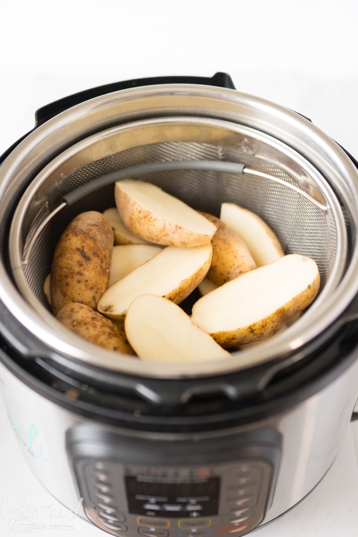 potato halves in the steamer basket in the Instant Pot for the twice baked potatoes