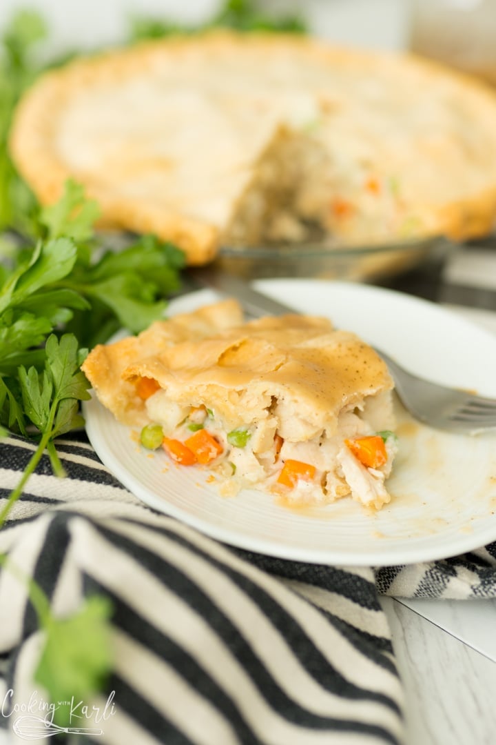 chicken pot pie recipe, baked, sliced and served on a plate