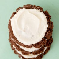 chocolate cookies with cheesecake frosting, stacked for final picture