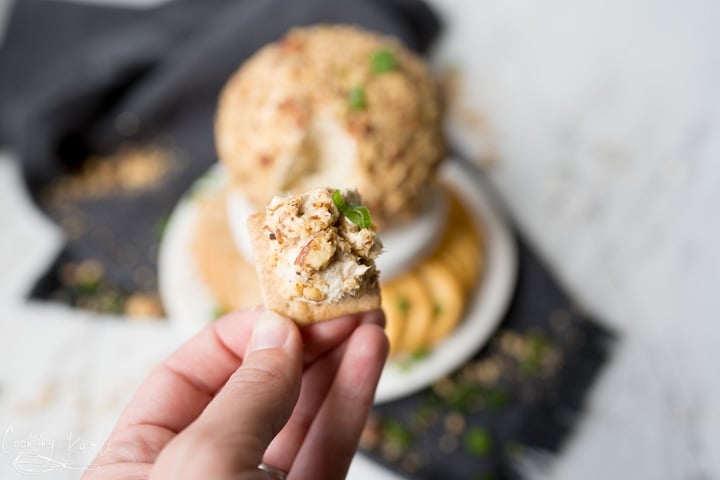 onion cheese ball on a cracker