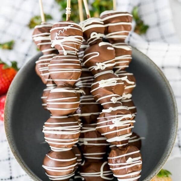 Chocolate covered strawberries on wooden skewers