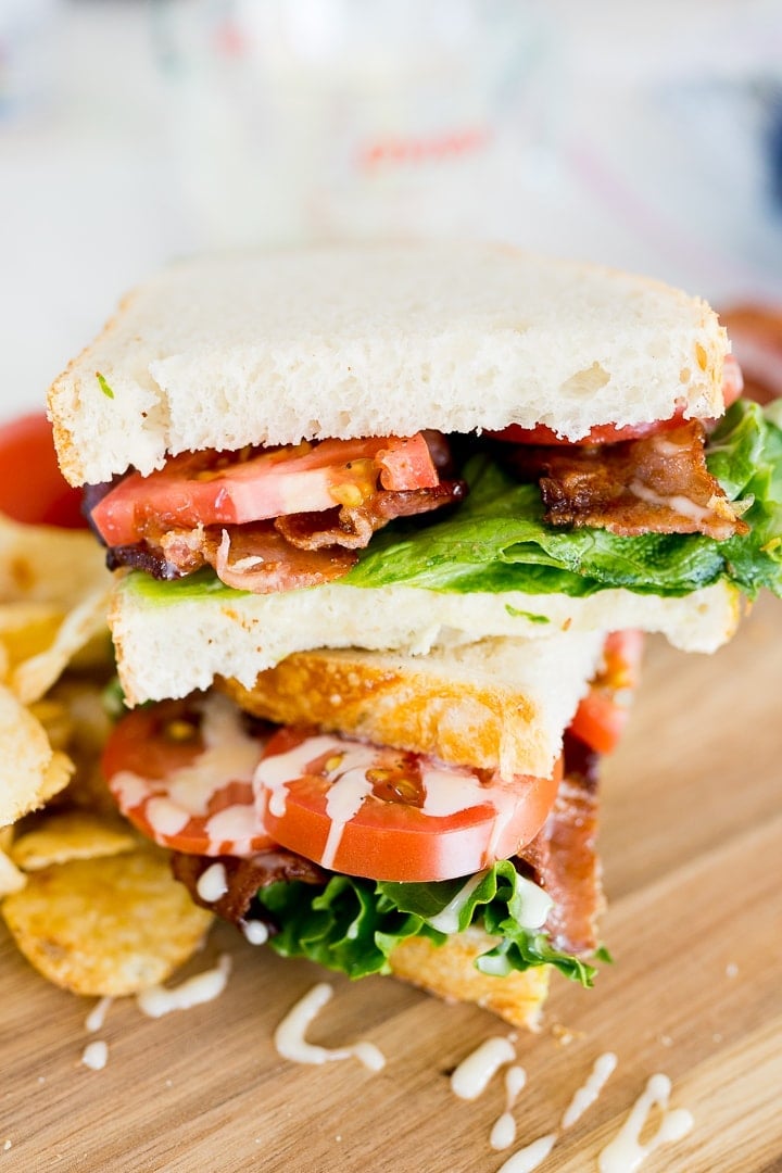 blt sandwich, made and cut in half.