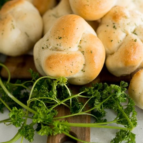 garlic knot with parsley, baked until golden brown and served on platter