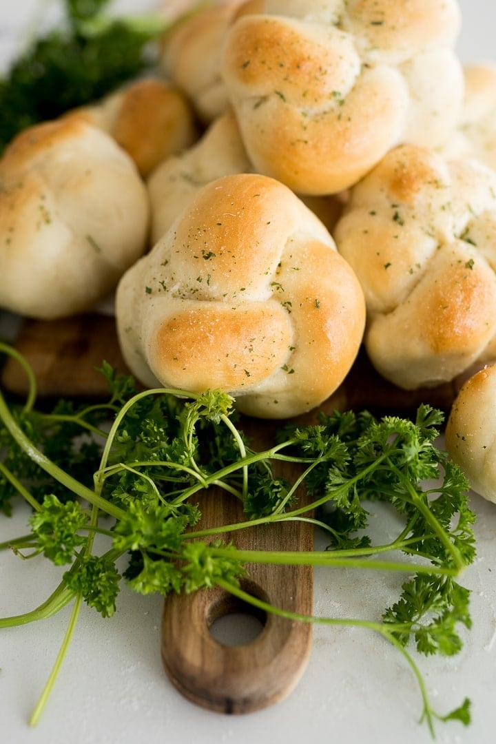 garlic knot with parsley, baked until golden brown and served on platter