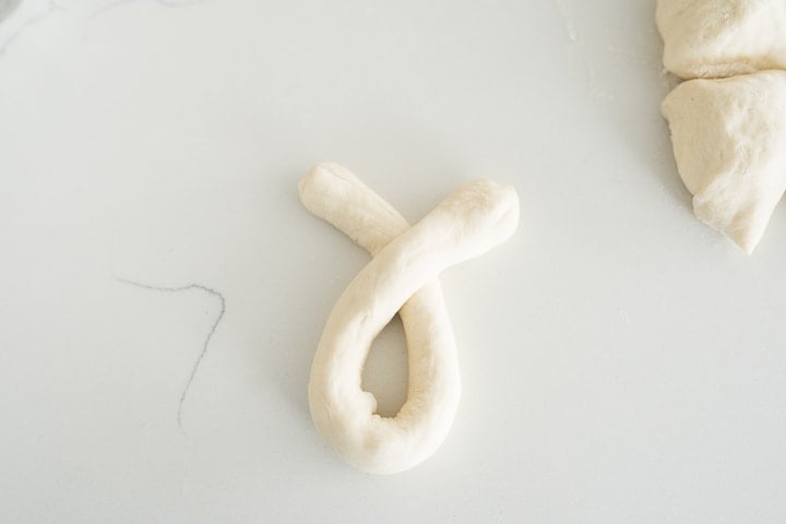 garlic knot being tied