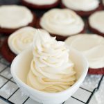cream cheese frosting, piped into a small bowl.