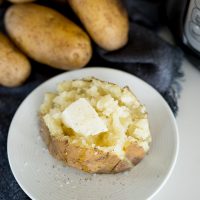 fluffy baked potato made in the Instant Pot with butter