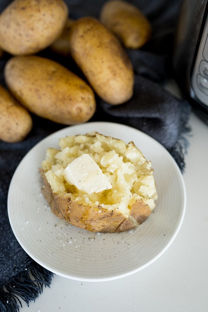 fluffy baked potato made in the Instant Pot with butter