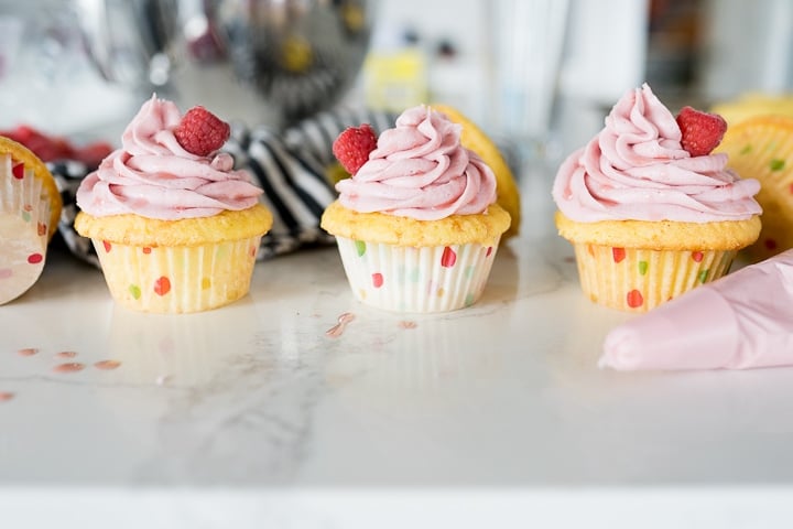 cupcakes with raspberry frosting on top