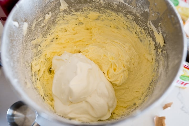 whipped cream being added to the cream cheese mixture