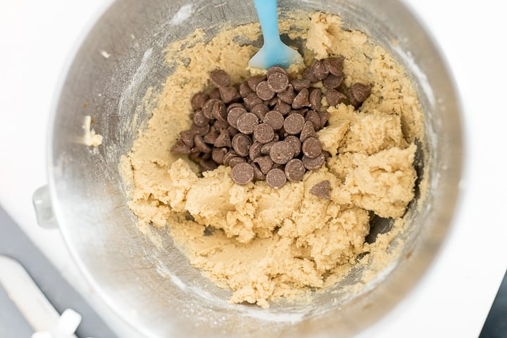 chocolate chip cookie dough batter, chocolate chips being folded in