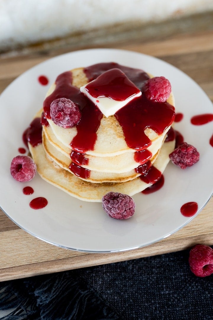 raspberry syrup on a stack of pancakes