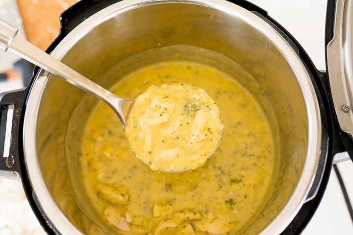 creamy cheesy sauce with broccoli and chicken in the Instant Pot 