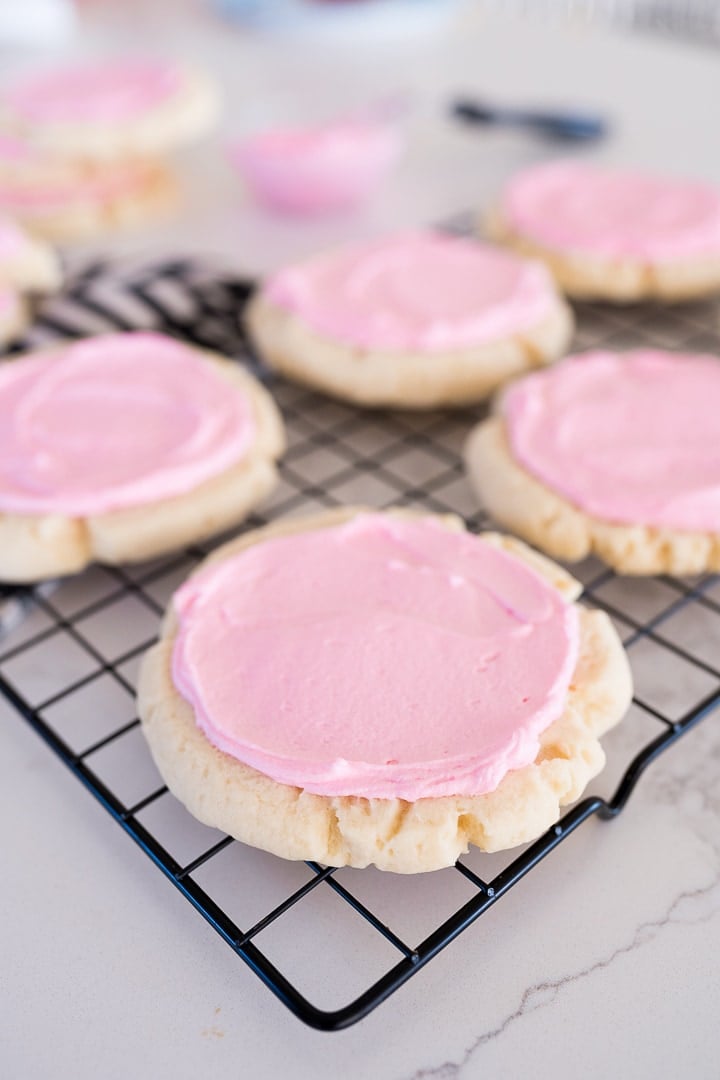crumbl sugar cookies on a cooling rack 