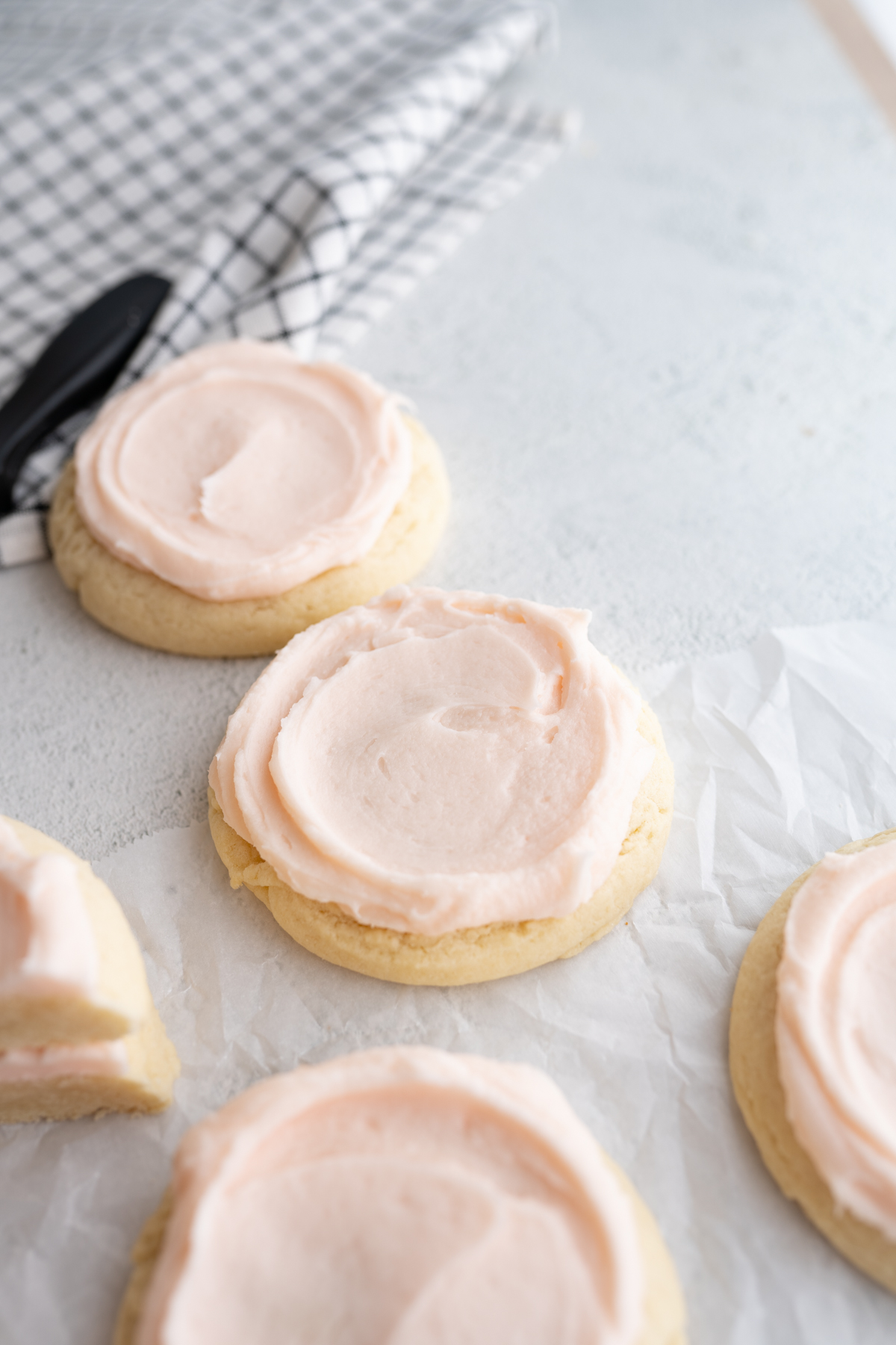 crumbl sugar cookies on parchment paper