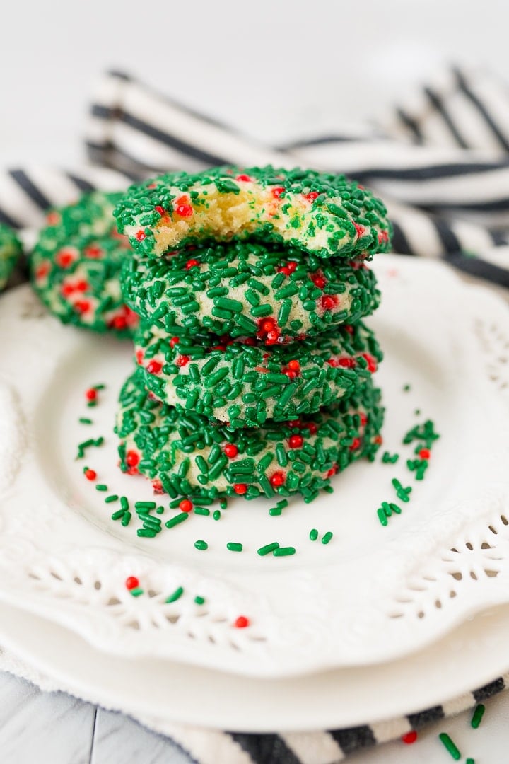 chirstmas sprinkle cookies stacked on a plate