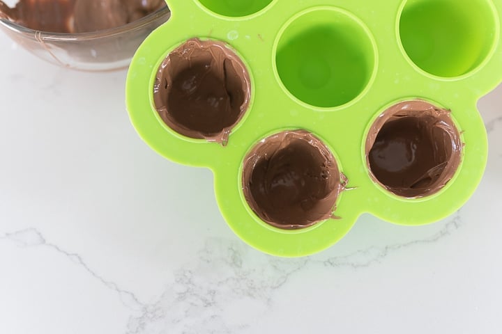 melted chocolate in an egg bite mold