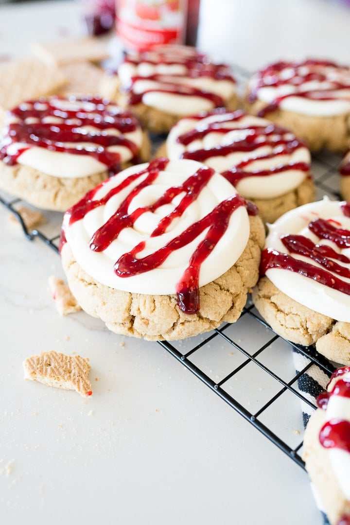 Crumbl Copy Cat Recipe for Raspberry Cheesecake Cookies, on a black cooling rack 
