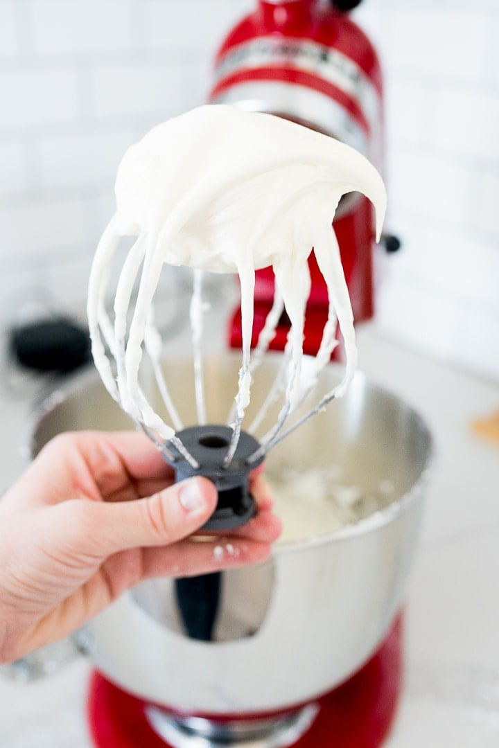 cheesecake frosting on the top of the mixing whisk